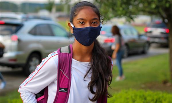 student smiles on first day of school